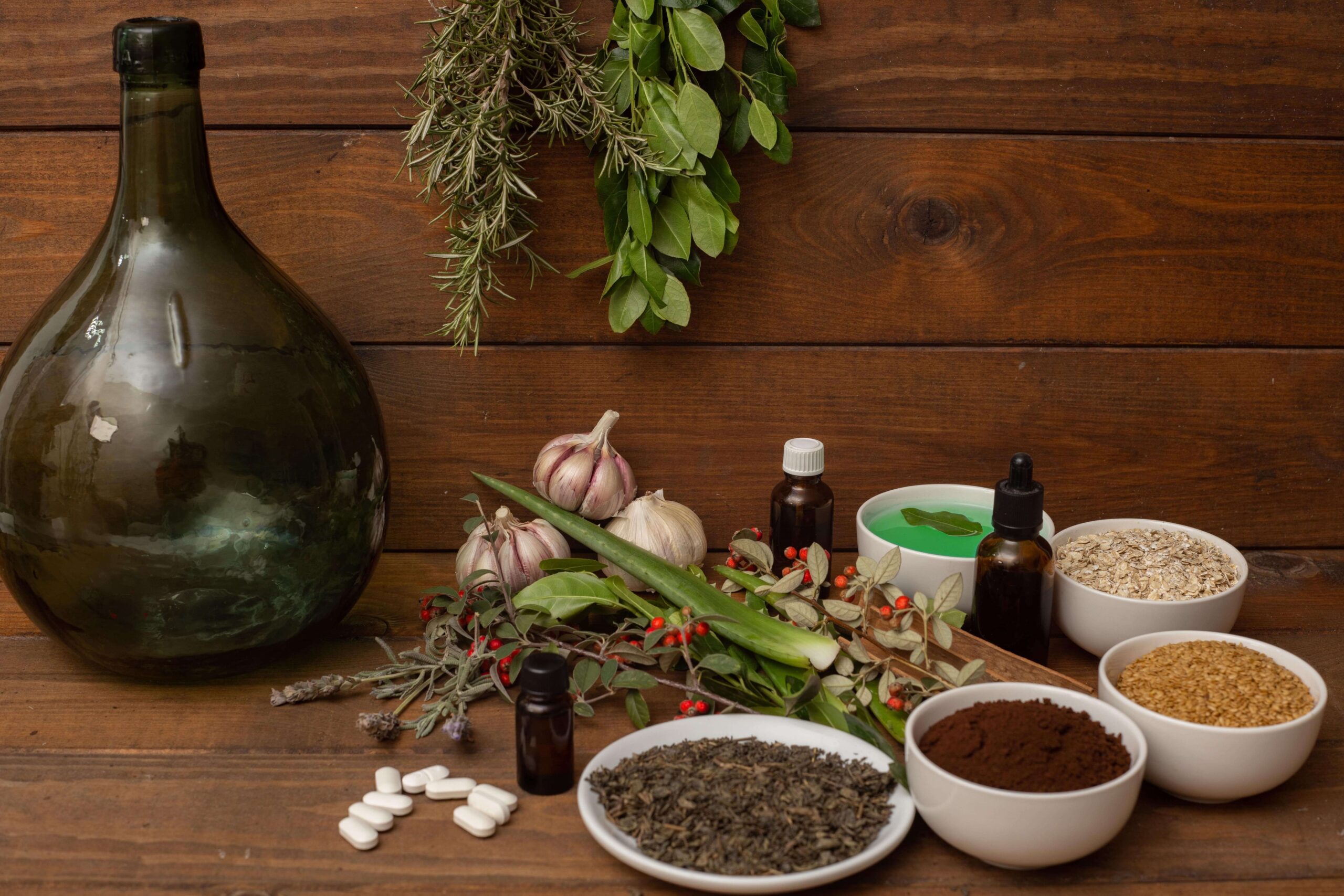 closeup of herbs spices pills on a wooden backgr 2023 11 27 05 26 53 utc min 1 scaled